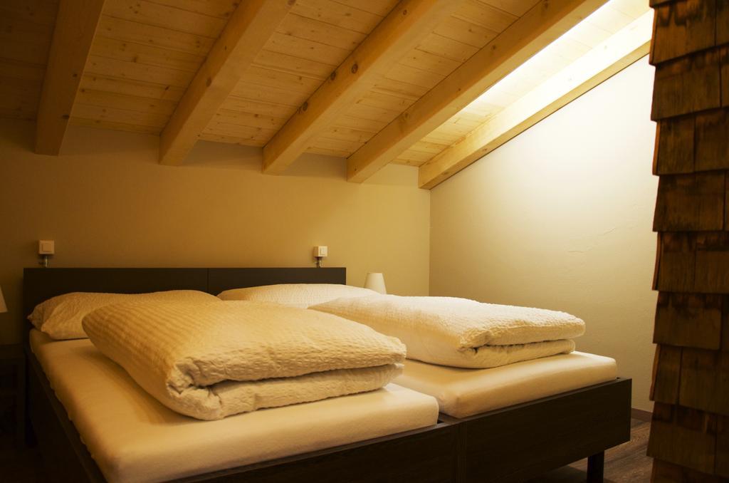 Hüttenhotel Husky Lodge Muotathal Værelse billede